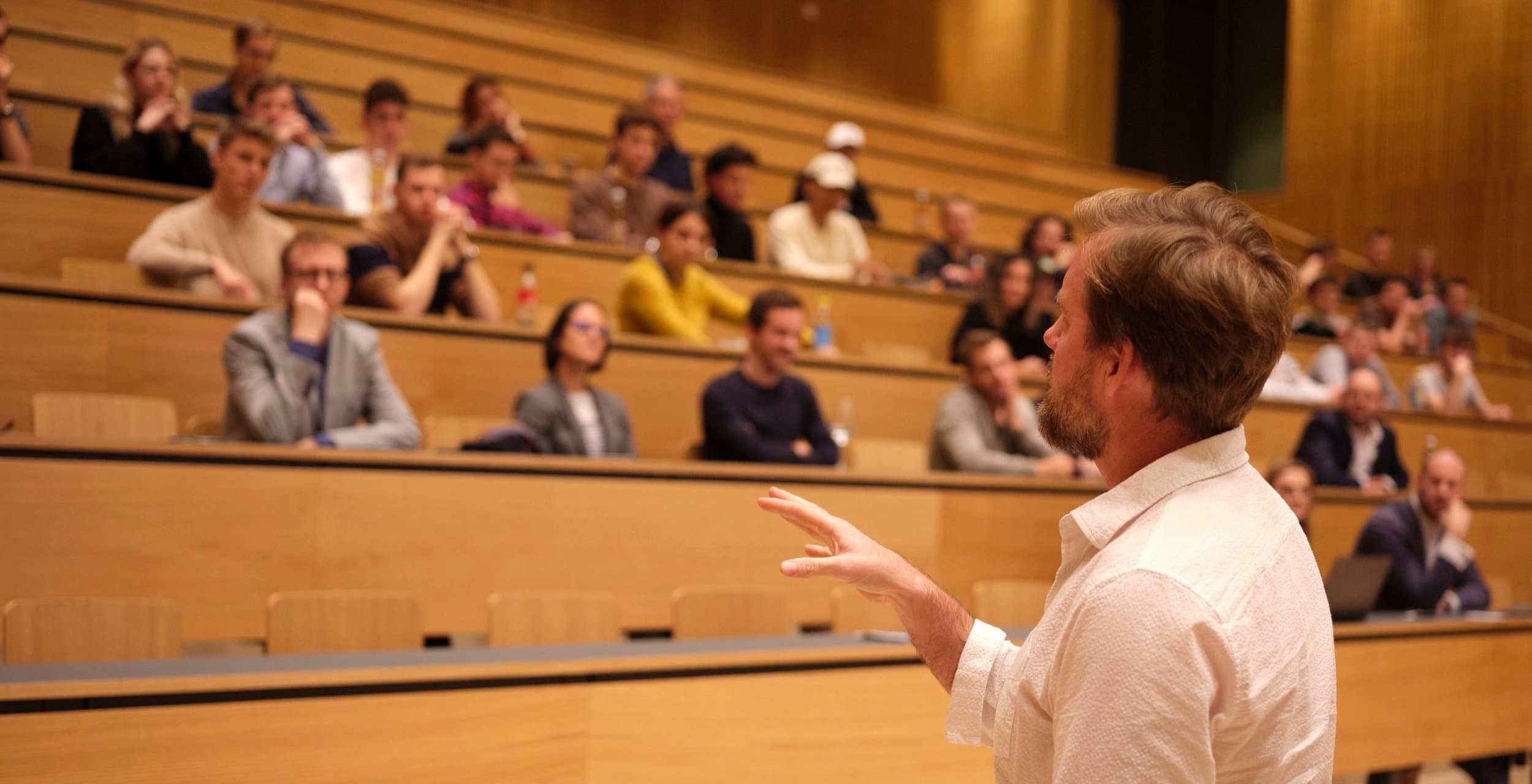 Clay speaking at an event